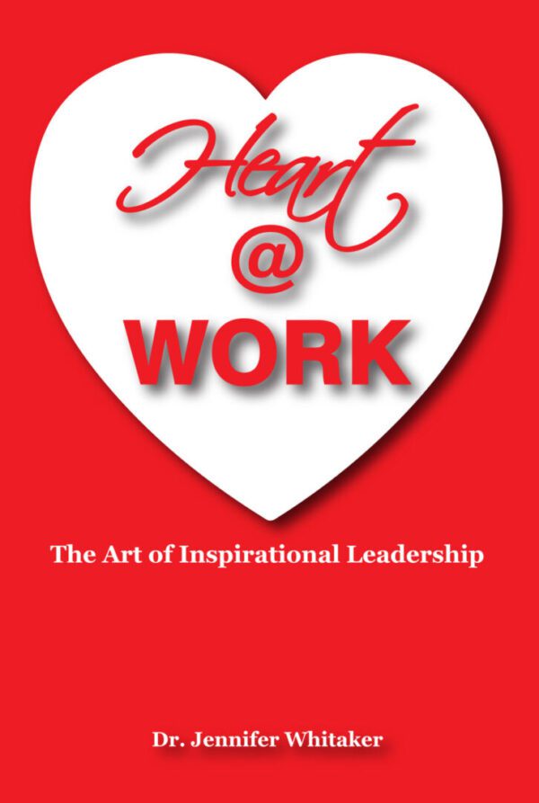 A red and white heart with the words " heart at work ".