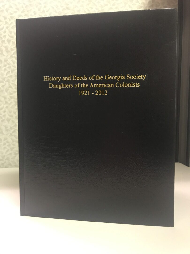 A black book with gold lettering on the cover.