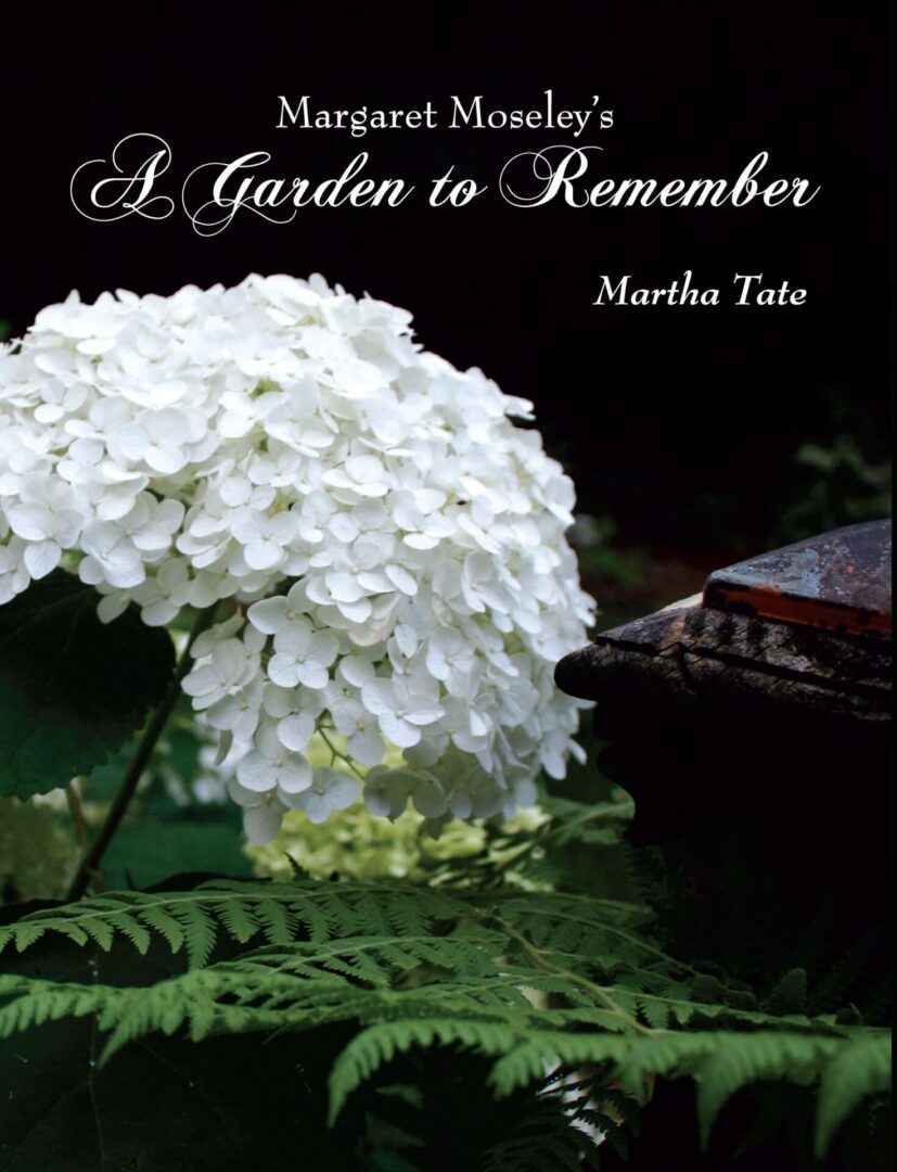 A book cover titled "Margaret Moseley's A Garden to Remember" by Martha Tate, featuring a close-up image of white hydrangea flowers with green foliage in the background.