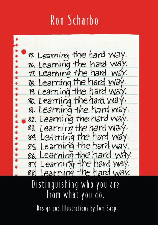 Sentence with product name: A book cover with repetitive handwritten phrases "Learning the hard way" on lined paper, titled "Ron Scharbo.