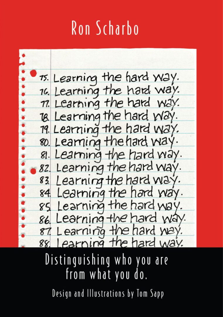 Sentence with product name: A book cover with repetitive handwritten phrases "Learning the hard way" on lined paper, titled "Ron Scharbo.