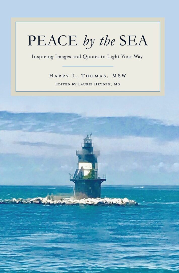 Book cover featuring a lighthouse on the sea with the title "Peace by the Sea" and authors' names.