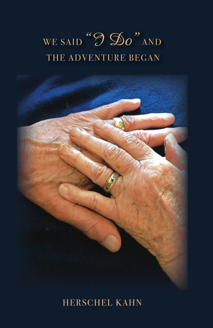 A close-up of two hands with wedding rings, one of which appears aged, over a dark background with the product name "We Said 'I Do' and the Adventure Began" about beginning an adventure together.