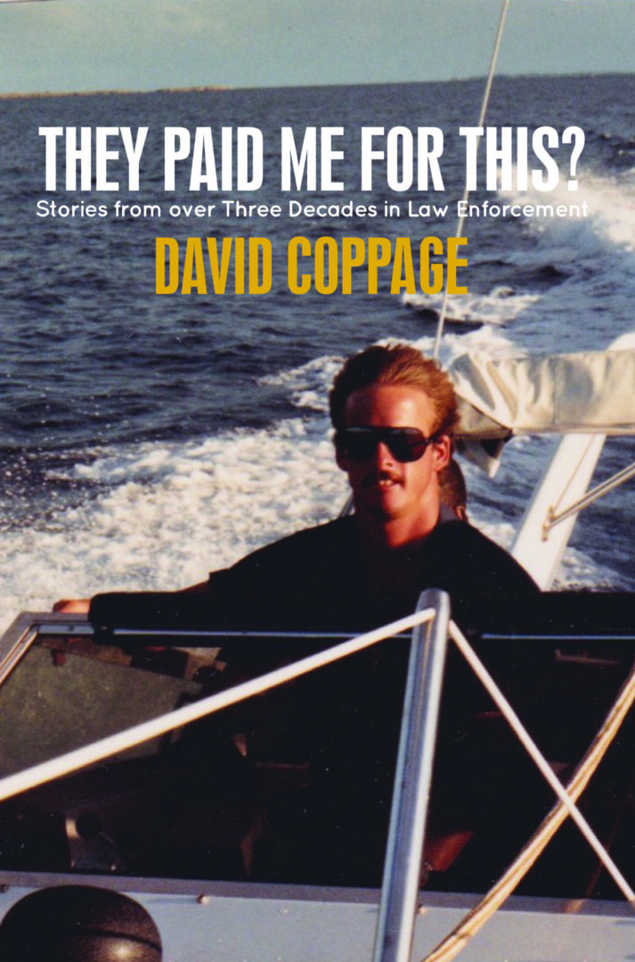 A person steering a boat with the title of the book "They Paid Me for This? Stories from Over Three Decades in Law Enforcement by David Coppage" overlayed.