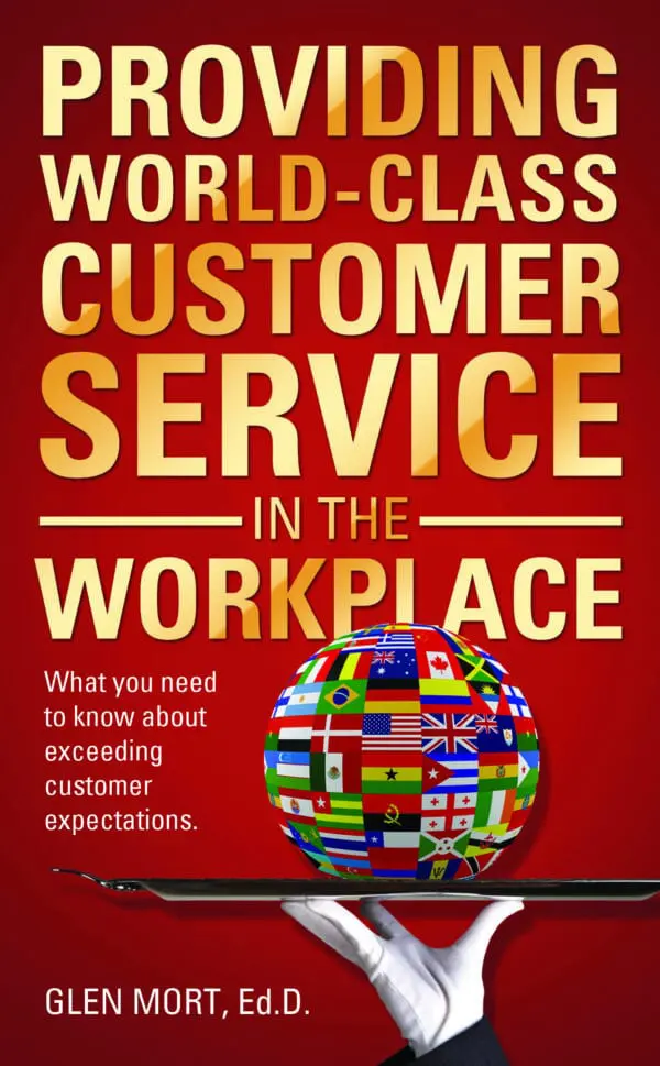 Cover of the book 'Providing World-Class Customer Service in the Workplace' by Glen Mort, Ed.D., featuring a globe with various flags and a waiter's hand holding it on a tray.