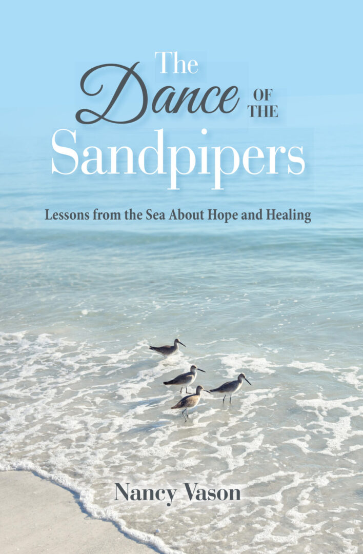 Birds walking along the shoreline on a beach with The Dance of the Sandpipers by Nancy Vason as the title and "lessons from the sea about hope and healing" as the subtitle.