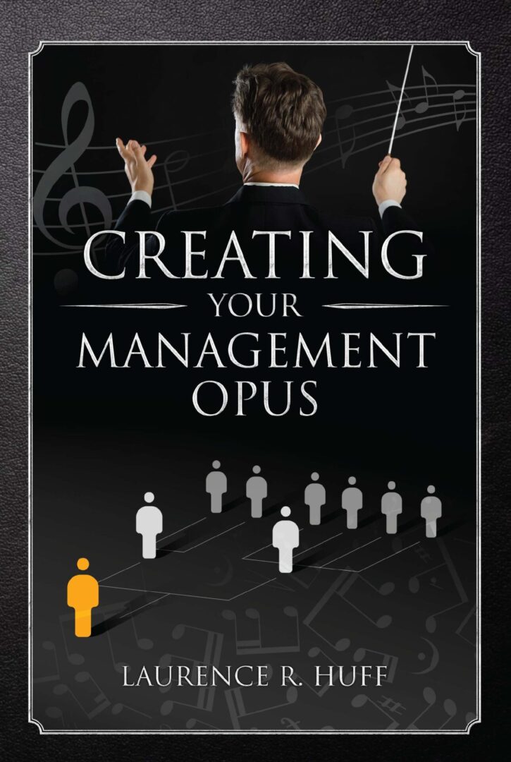 A man conducting with the book cover "Creating Your Management Opus" by Laurence R. Huff.