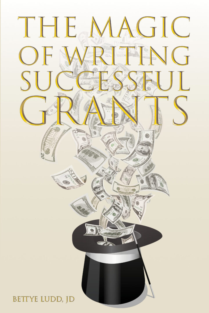 Book cover titled "The Magic of Writing Successful Grants" by Bettye Ludd, JD, featuring an illustration of dollar bills emerging from a magician's top hat.