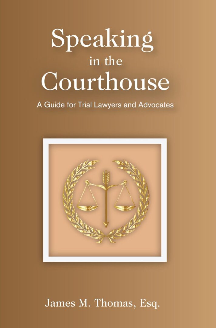 A book cover of "Speaking in the Courthouse" by james m. thomas, esq., featuring a gold scale of justice emblem.